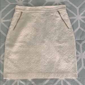 White, above knee skirt with gold embellishments